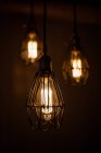 Close up view of modern creative light bulbs on dark background — Stock Photo