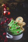 Still life of christmas cookies in sauce pot and Christmas decorations — Stock Photo