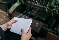 Crop hands binding paper sheets — Stock Photo