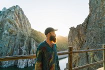 Portrait of bearded man on terrace at mountain countryside — Stock Photo