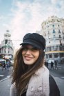 Close up portrait of smiling brunette woman on street — Stock Photo