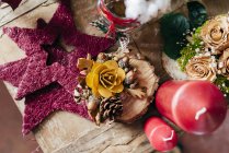 Directly above view of decorations on wooden table — Stock Photo