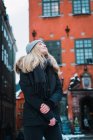 Portrait of blond woman enjoying winter air on street — Stock Photo