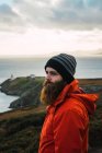 Portrait of bearded man posing coastal hills — Stock Photo