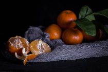 Still life of fresh tangerines on old table — Stock Photo