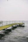 Pier and sea in cloudy weather — Stock Photo
