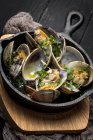 Low angle view of clam stew in white wine sauce. — Stock Photo