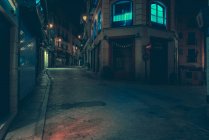 Exterior view to dark empty street and road in city at night. — Stock Photo