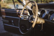 Close-up of car steering wheel in sunset light — Stock Photo