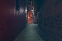 Perspective view to passage on street at night. — Stock Photo