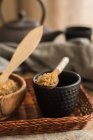 Close up view of spoon with brown sugar on tea cup — Stock Photo