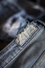 Close up view of teared blue jeans — Stock Photo