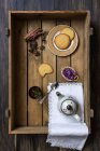 Ceramic teapot with cup of green tea and cookies on wooden tray — Stock Photo