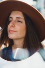 Sensual young woman in hat looking away — Stock Photo