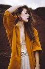 Brunette girl posing in jacket at nature — Stock Photo