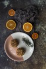 Falafel on plate and orange slices on table — Stock Photo