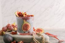 Glass of chia smoothie with coconut milk on stone table — Stock Photo