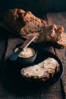 Still life of rustic bread with butter — Stock Photo