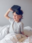 Smiling boy taking off VR glasses and looking at camera — Stock Photo