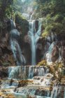 Scenic view to small tropical waterfalls in jungle — Stock Photo