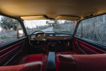 Interior of vintage old car parked in nature — Stock Photo