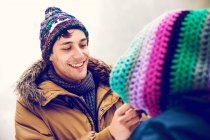 Cheerful man looking at woman in winter outdoors — Stock Photo