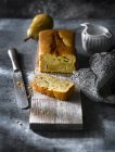 Freshly baked pear cake on wooden board — Stock Photo