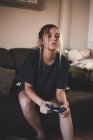 Woman playing on play station — Stock Photo