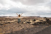 Woman standing in rocky nature — Stock Photo