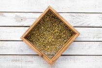 Box with dry chamomile spice — Stock Photo