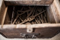 Instruments from open box of wooden table with joiner tools — Stock Photo