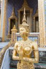 Golden statue in palace — Stock Photo
