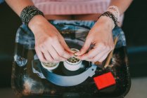 Woman preparing marijuana joint — Stock Photo