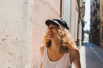 Curly woman laughing on street — Stock Photo