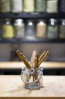 Cinnamon sticks on counter in spice shop — Stock Photo