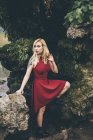 Blonde woman standing in nature — Stock Photo