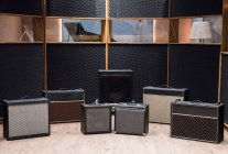 Set of amplifiers near piano — Stock Photo