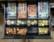 Cash and coins in till — Stock Photo