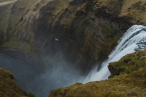 Huge waterfall and cliffs — Stock Photo