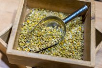 Box with dry chamomile spice — Stock Photo