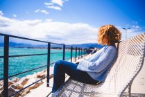 Woman relaxing at seaside — Stock Photo