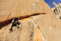 Rock climber man climbing a steep granite crack, La Pedriza, Spain — Stock Photo