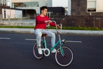 Man riding vintage bicycle — Stock Photo