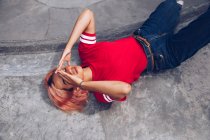 Woman lying on ground — Stock Photo