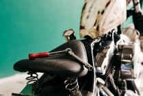 Wrench on motorcycle seat — Stock Photo