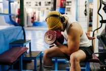 Man exercising with dumbbell in gym — Stock Photo