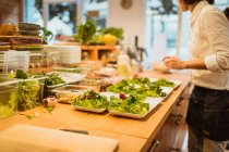 Cook preparing salad in kitchen — Stock Photo