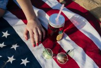 Female hand on American flag — Stock Photo