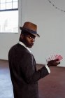 Handsome man with playing cards — Stock Photo
