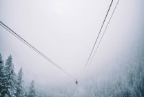 Funicular traveling in snowy landscape — Stock Photo